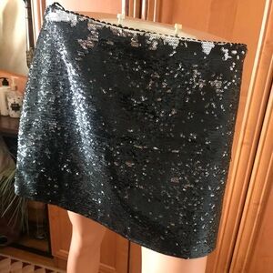 Tealf black/silver sequenced mini skirt in size L. Stretchy. Like new.
